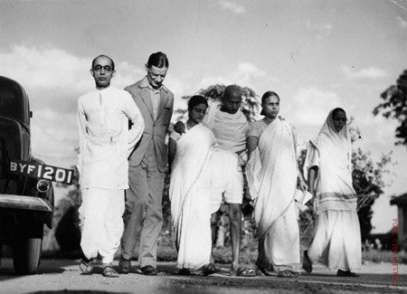 Mohandas Gandhi walking with Horace Alexander by Margaret Bourke-White