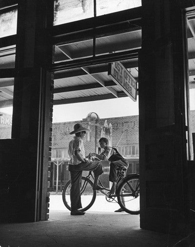 Post Office with two boys and bicycle by Andreas Feininger