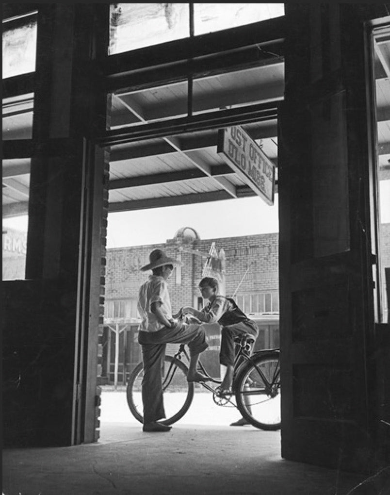 Post Office with two boys and bicycle by Andreas Feininger