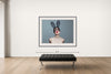 Room view — Bunny II by Tyler Shields shown to scale on a gallery wall at 56 x 72 in. Not a reproduction of the work.