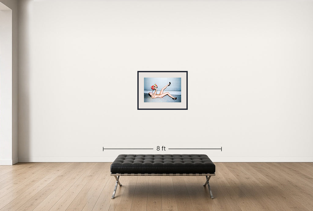 Room view — Skye Peters eats Fruit Loops by Tyler Shields shown to scale on a gallery wall at 22 x 30 in. Not a reproduction of the work.