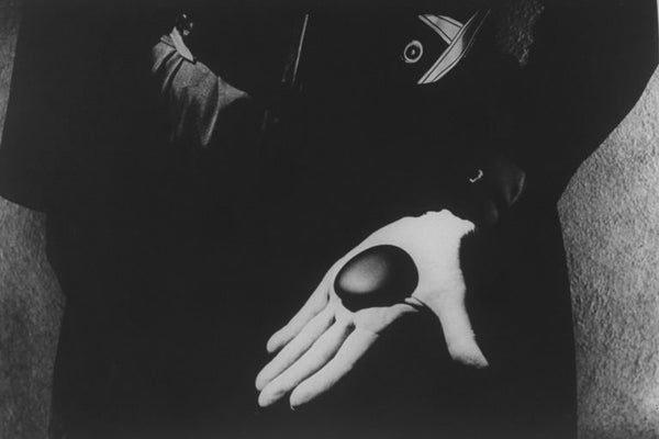 Georgia O'Keeffe holding one of her favorite stones (Eliot Porter's rock) in her palm. - John Loengard