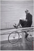 Bike Racer Reads in Six Day Race by Ralph Morse