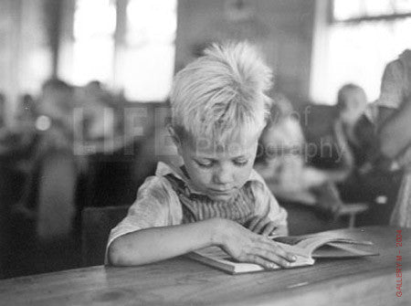 Boy Reading in School by Carl Mydans